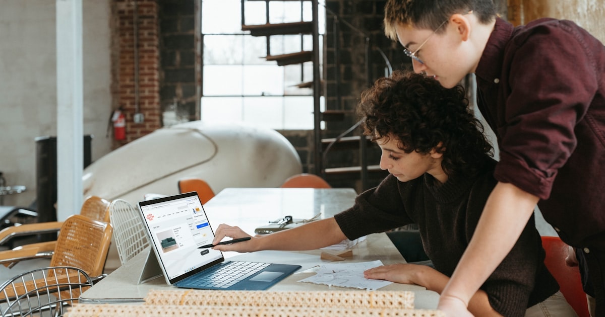 Construction workers on job site using mobile time tracking application