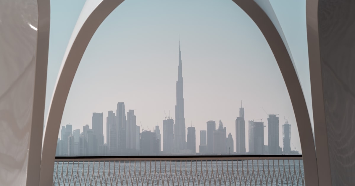 Middle East business skyline with workforce compliance overlay graphics